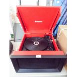 A red and black Steepletone record deck with FM and AM speaker