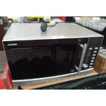 A Kenwood microwave oven in a stainless steel finished case