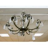 An eight branch gilt metal and glass lustre hanging chandelier with some wall lights and shades