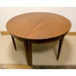 A Georgian mahogany D end extending dining table with one centre leaf on square taper legs,