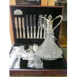 A butler Kings pattern plated canteen of cutlery and a glass and plated ships claret jug