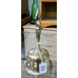 An Indian brass hand bell 20cms tall