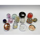 A collection of various paperweights to include Kerry glass,