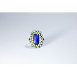 Antique turquoise pearl and blue stone panel cluster ring set in a rectangular panel,