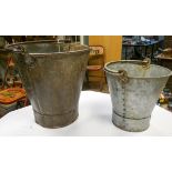 A small old steel pail and larger one