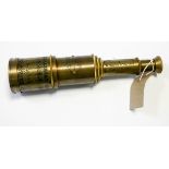 A reproduction four drawer brass telescope