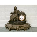 A French striking mantle clock with spelter poet figure mount on a marble and gilt metal decorative