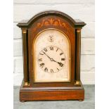 An Edwardian striking bracket clock in inlaid mahogany case with arched silver dial