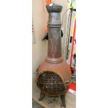A large cast iron garden chiminea approx 4' tall