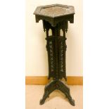 An hexagonal carved oak plant pedestal on a tripod base similar to previous lot 39 1/2" tall