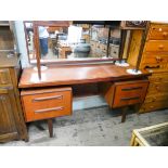 A 1970's GPlan teak kneehole dressing table 4' wide
