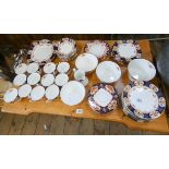 A blue gilt and floral bordered china teaset