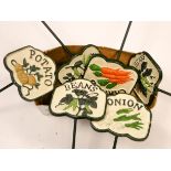 Six cast iron vegetable signs