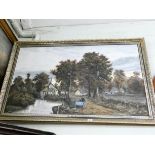 A large gilt framed oil painting of a river and country scene