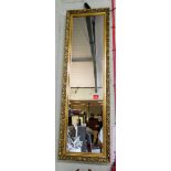 A long dressing mirror in Victorian style gilt frame