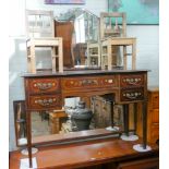 An Edwardian inlaid mahogany concave front kneehole dressing table with triple mirrors