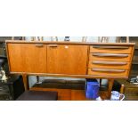 A 1970's GPlan teak long low sideboard fitted cupboards and four drawers 5'6 long