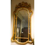 A large Victorian cushion style wall mirror in decorative gilt frame approx 56" x 27"