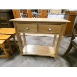 A light oak two tier hall table fitted two drawers 33" wide