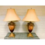 A pair of brown mottled vase shaped table lamps with gilt metal mounts and gold coloured shades 27"