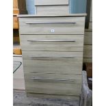 A modern light oak finished tallboy chest of four long drawers 2'6 wide matching the previous lot