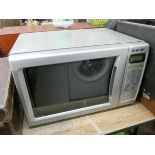 A Sharp microwave oven in a silver case