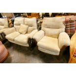 A wood framed two seater settee three piece lounge suite in faun covering with loose cushions