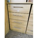 A modern light oak finished chest of four long drawers 2' wide matching the previous lots