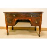 An Edwardian inlaid mahogany kneehole desk or dressing table fitted four drawers standing on square