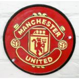 A Manchester United cast iron wall hanging plaque