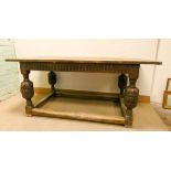 An antique oak refectory dining table on carved bulbous legs with cross stretchers,
