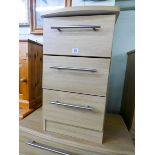 A modern light oak finished bedside chest of three drawers matching the previous lots
