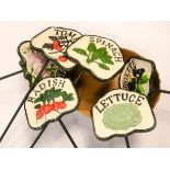 Six cast iron vegetable signs