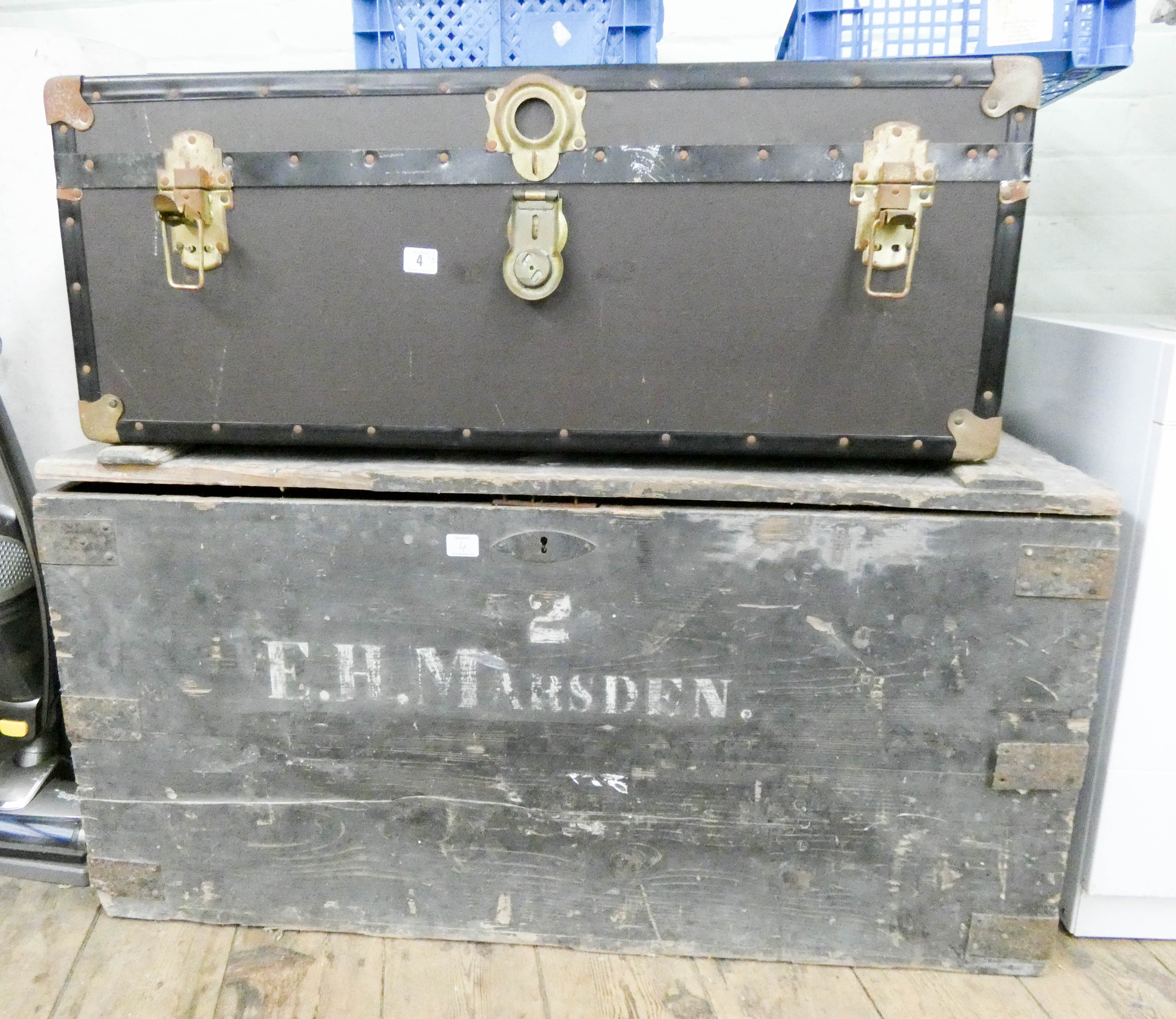 A large old wooden trunk and one other trunk