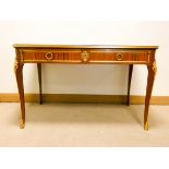 A French Kingwood library or centre table with mahogany cross banding fitted two drawers with gilt