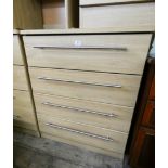 A modern light oak finished chest of four long drawers 2'6 wide matching the previous lot