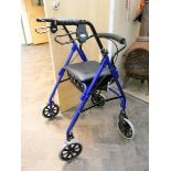 A fold up Zimmer frame with bag seat,