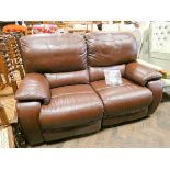 A brown leather two section reclining two seater settee In fair condition a few