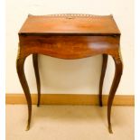 A French floral inlaid Kingwood bureau de dame with Bombe fall standing on cabriole legs with gilt