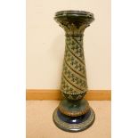 A Doulton leaf decorated jardiniere pedestal, top damaged and fitted with a later marble top,
