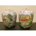 A pair of large Cantonese ginger jars with covers decorated with flowers and hunting scenes