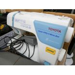 A Toyota super utility and mono dial sewing machine