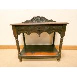 A 3' late Victorian carved oak two tier hall table fitted one drawer