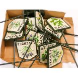 Twelve painted cast iron herb signs