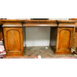 A Victorian mahogany break front sideboard on pedestal base fitted cupboards and three drawers 70"