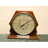 A Storm guide large circular barometer and thermometer by Short & Mason London in a freestanding