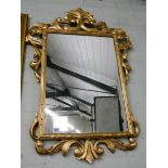 A Victorian style gilt framed wall mirror with wooden frame