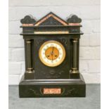 A large Victorian striking mantle clock in b lack marble case