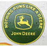 A John Deer cast iron wall hanging plaque