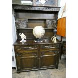 A 4' reproduction oak Welsh style dresser with small lead light cabinets in the back